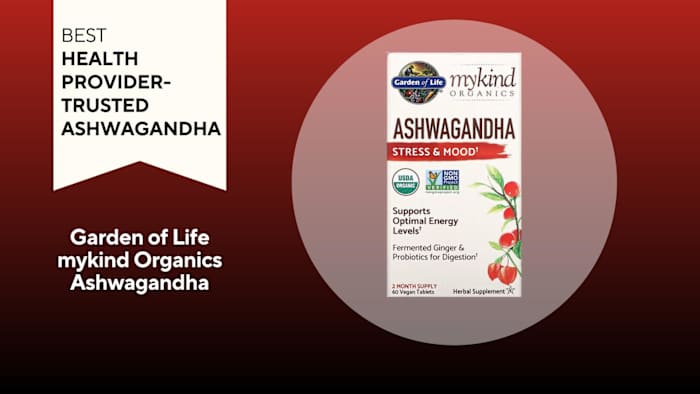 A bottle of Garden of Life Ashwagandha against a red background